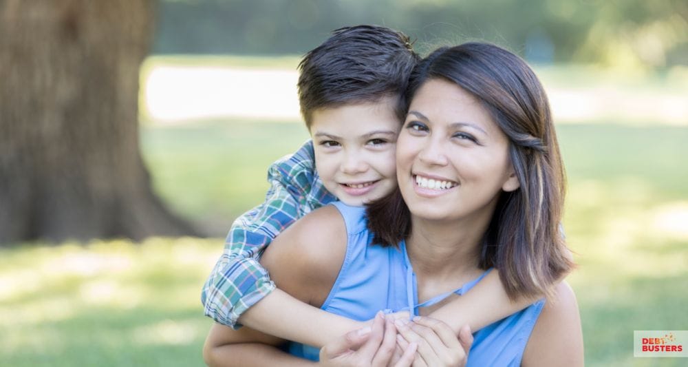 Smiling mother and child enjoying support from financial hardship grants for single mothers Australia.